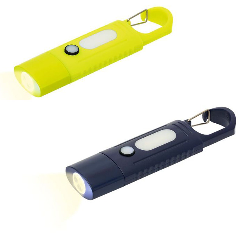 Zwei Expedition Natur Clip-Taschenlampen in Gelb und Blau leuchten. Beide sind mit einem Karabinerhaken ausgestattet und haben eine seitliche Lichtleiste sowie eine Frontleuchte.