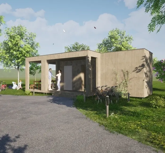 digitale Skizze eines WC-Gebäudes der Firma Innoprojekt.at aus Stainz - es steht auf eier grünen Wiese an einem Weg mit rundum Bäumen und 2 Menschen befinden sich vor dem Eingang.